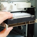 Easy installation of HDD with sliding drive brackets. Image shows the sliding drive brackets for easy HDD installation.